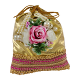 Matching potli bag with Golden Karwa Chauth thali set