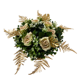 Table center pieces ,Floral arrangement with candles on a soft background and glass candle holder.