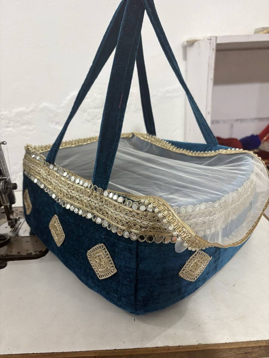 Laddu Gopal in Royal Red basket — devotional display