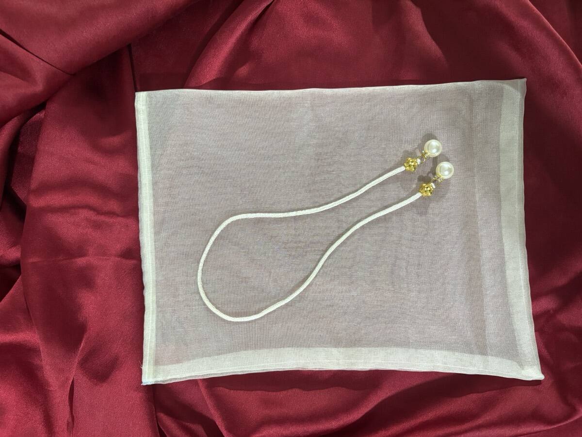 White organza potli bag for wedding favours